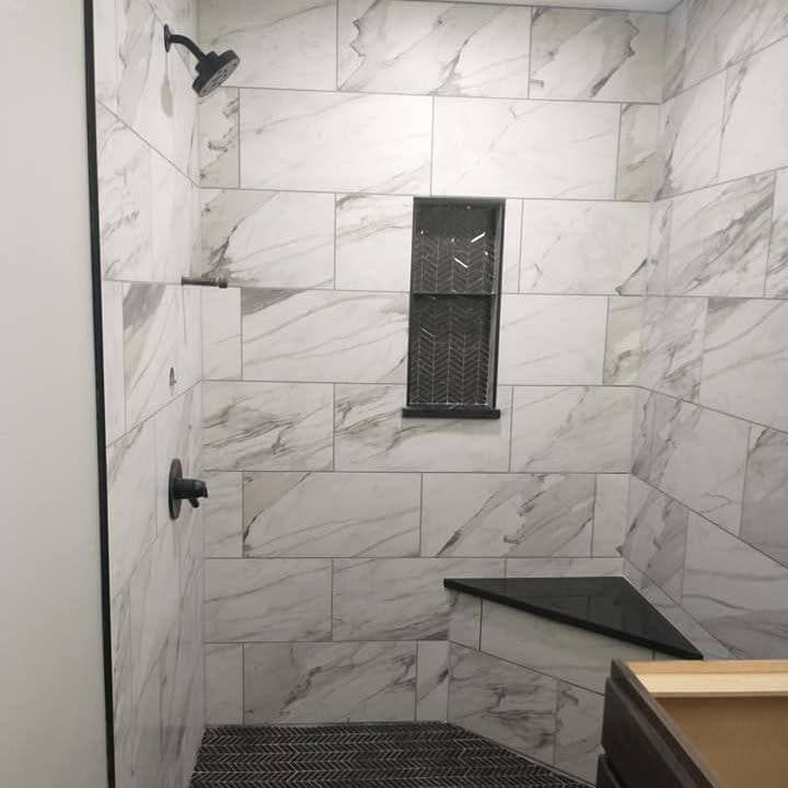 Marble shower with niche and bench