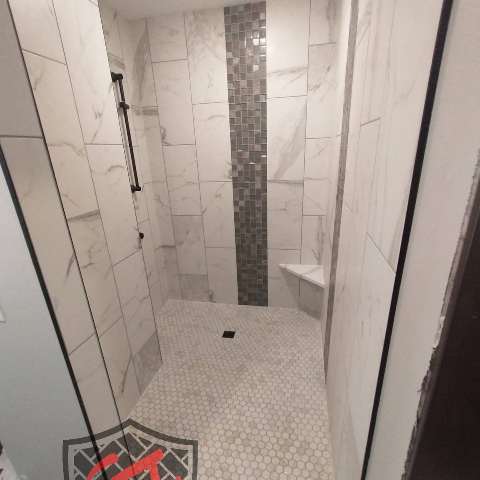 Walk-in shower with mosaic accent